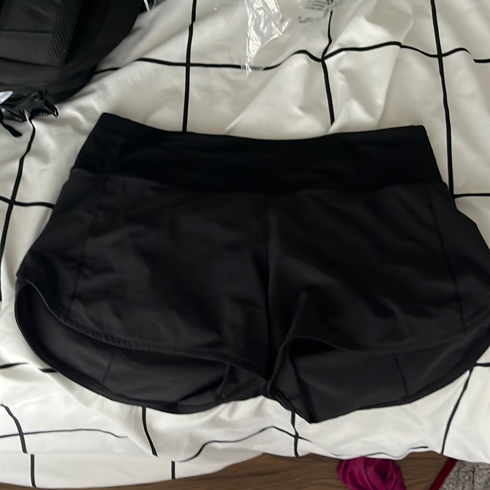 black lulu mid rise speed ups 4”